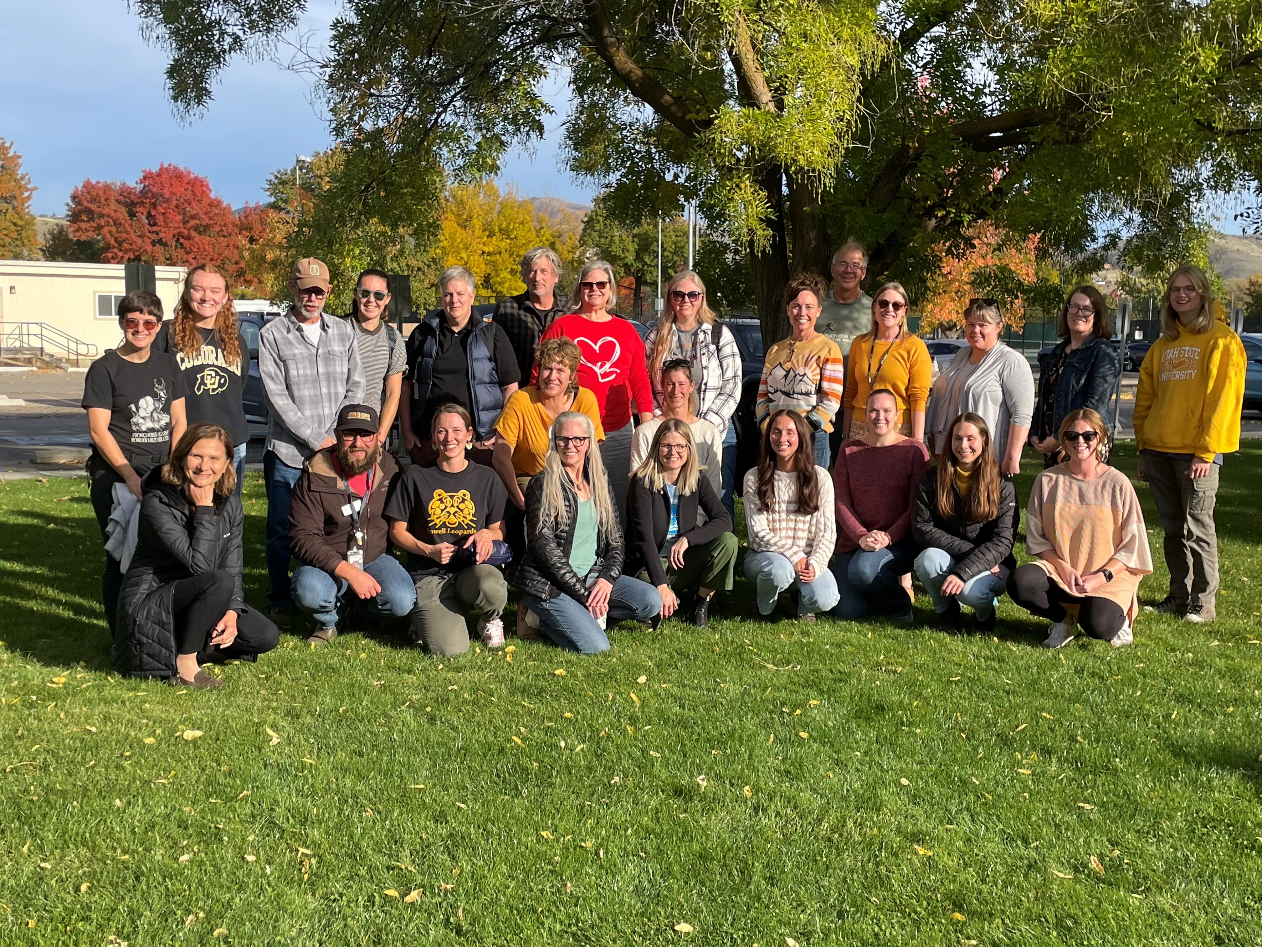 A large group of adult participants during an Earth to Sky workshop.