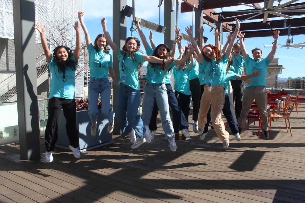 A group of enthusiastic student leaders at an event for the Youth Climate Action Council.